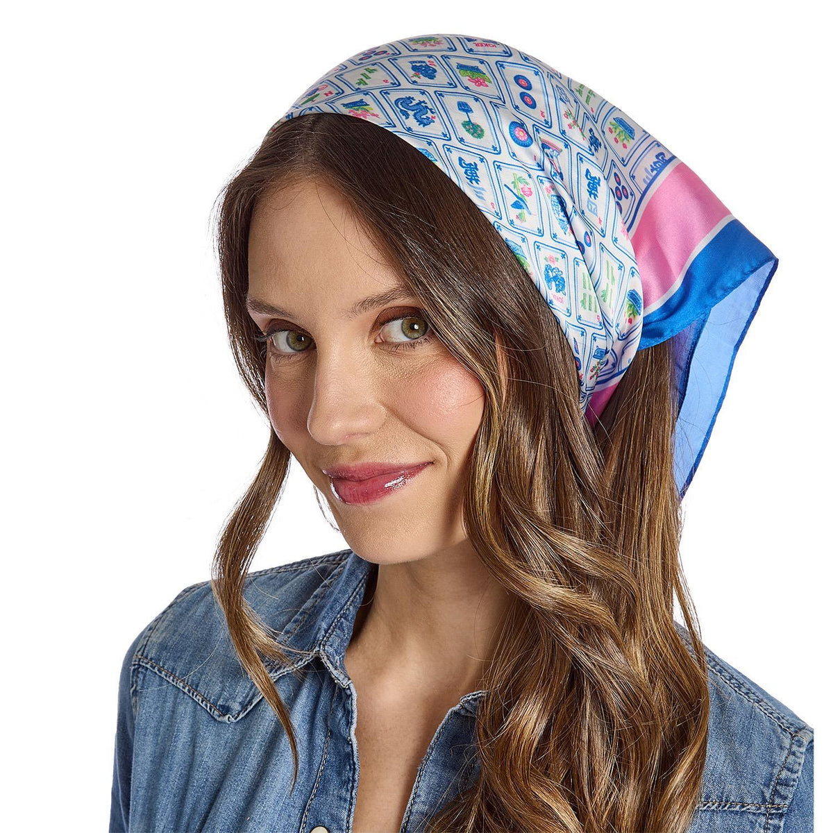 Woman wearing a colorful mahjong pattern headscarf with a white background