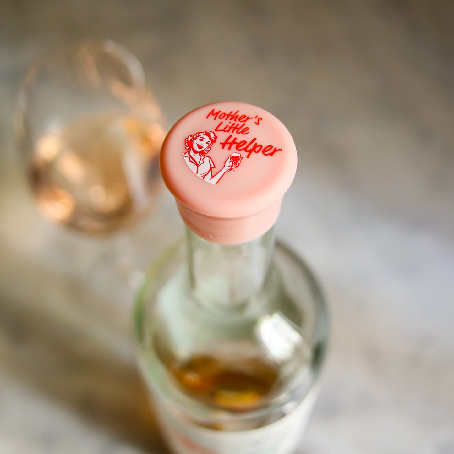 pink wine bottle cap labeled 'Mother's Little Helper'