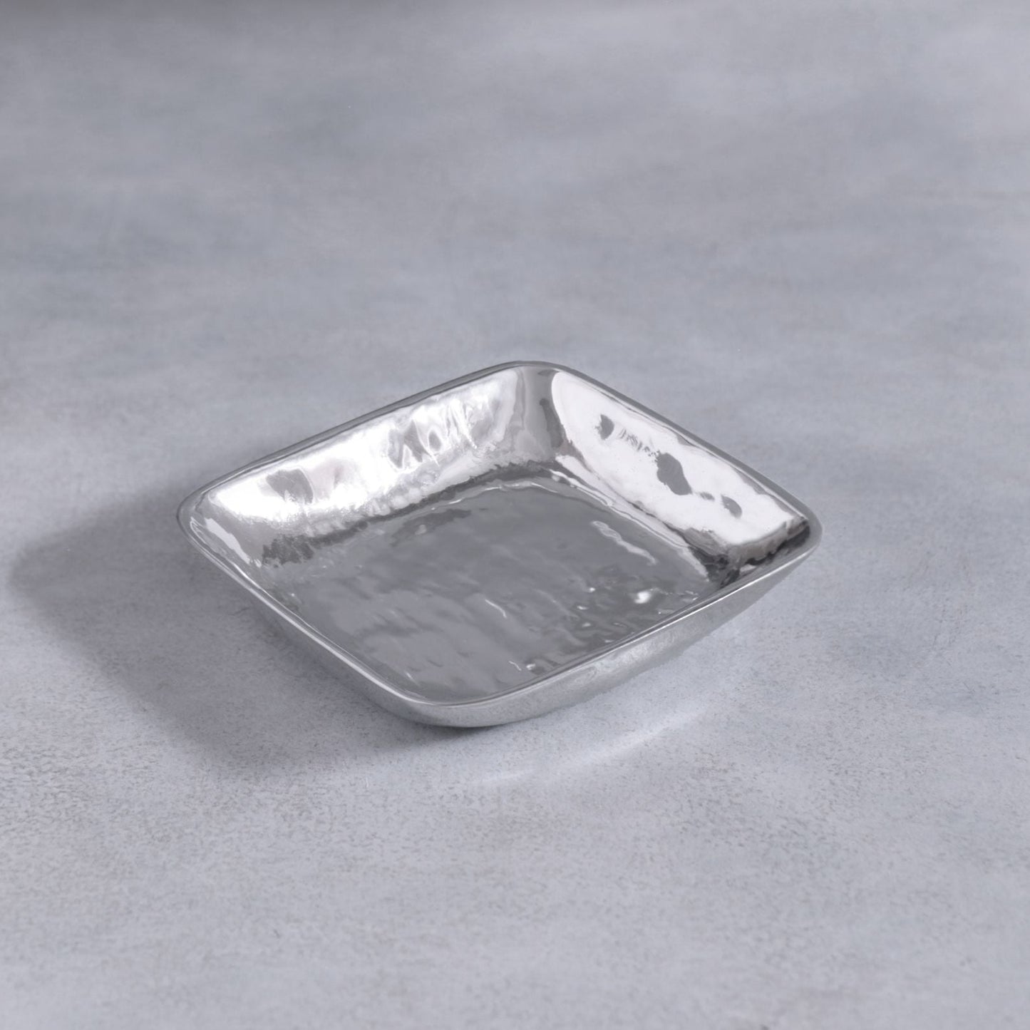 A small, square, silver Beatriz Ball Soho Emerson bowl.