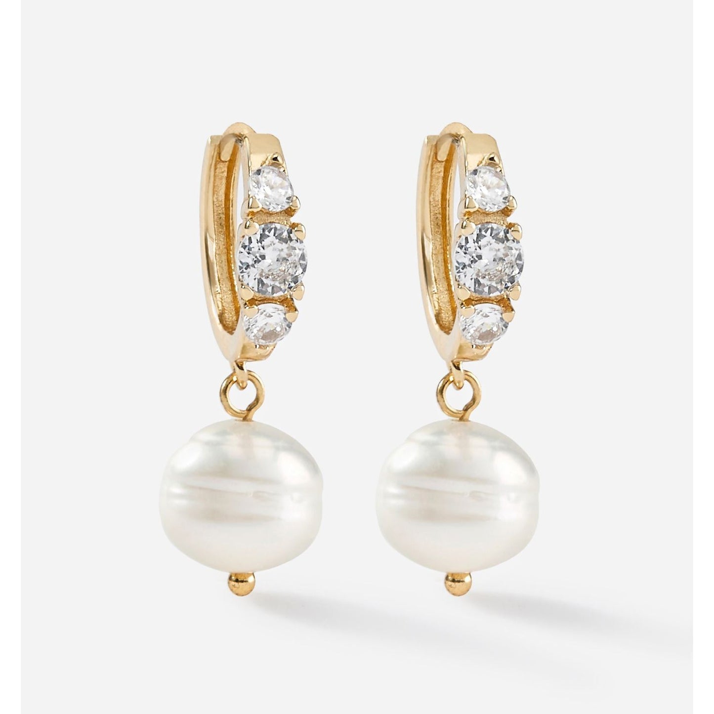 Gold Charlie Paige Diamond Studded Drop Pearl Earrings with pearl drops on a white background