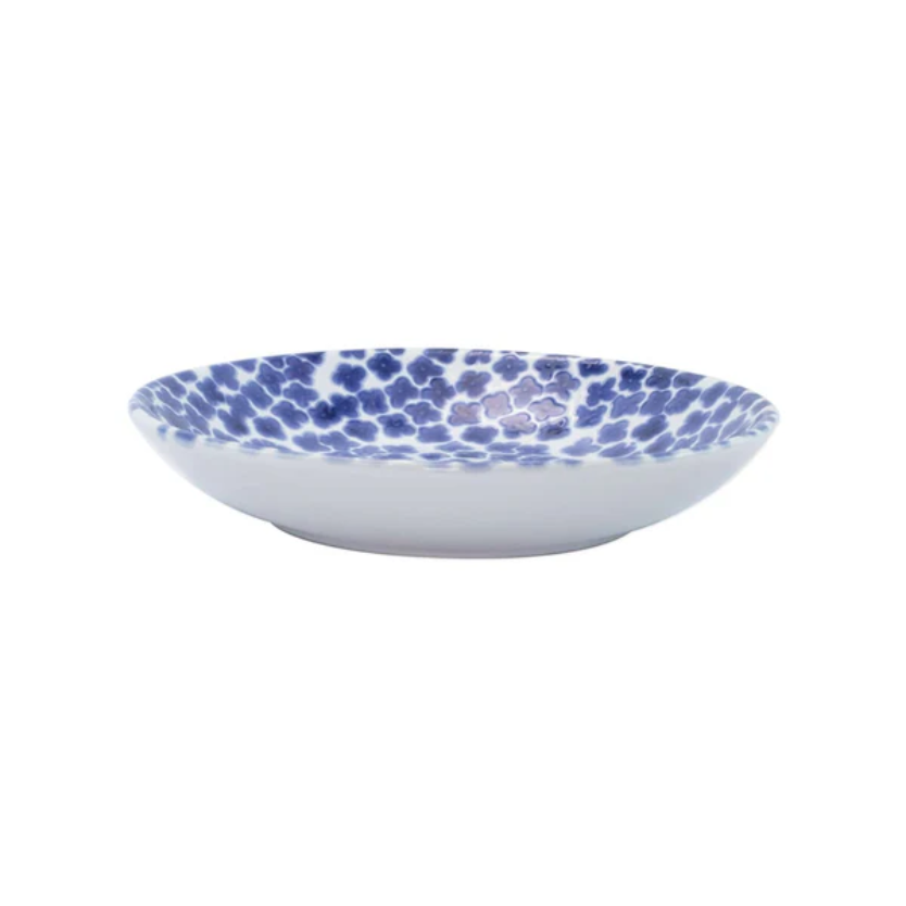 Ceramic bowl with blue floral pattern on a white background