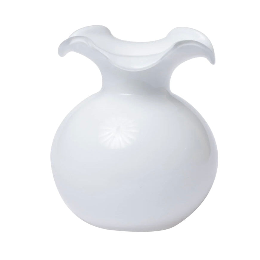 A white, small fluted glass vase with a hibiscus flower design.