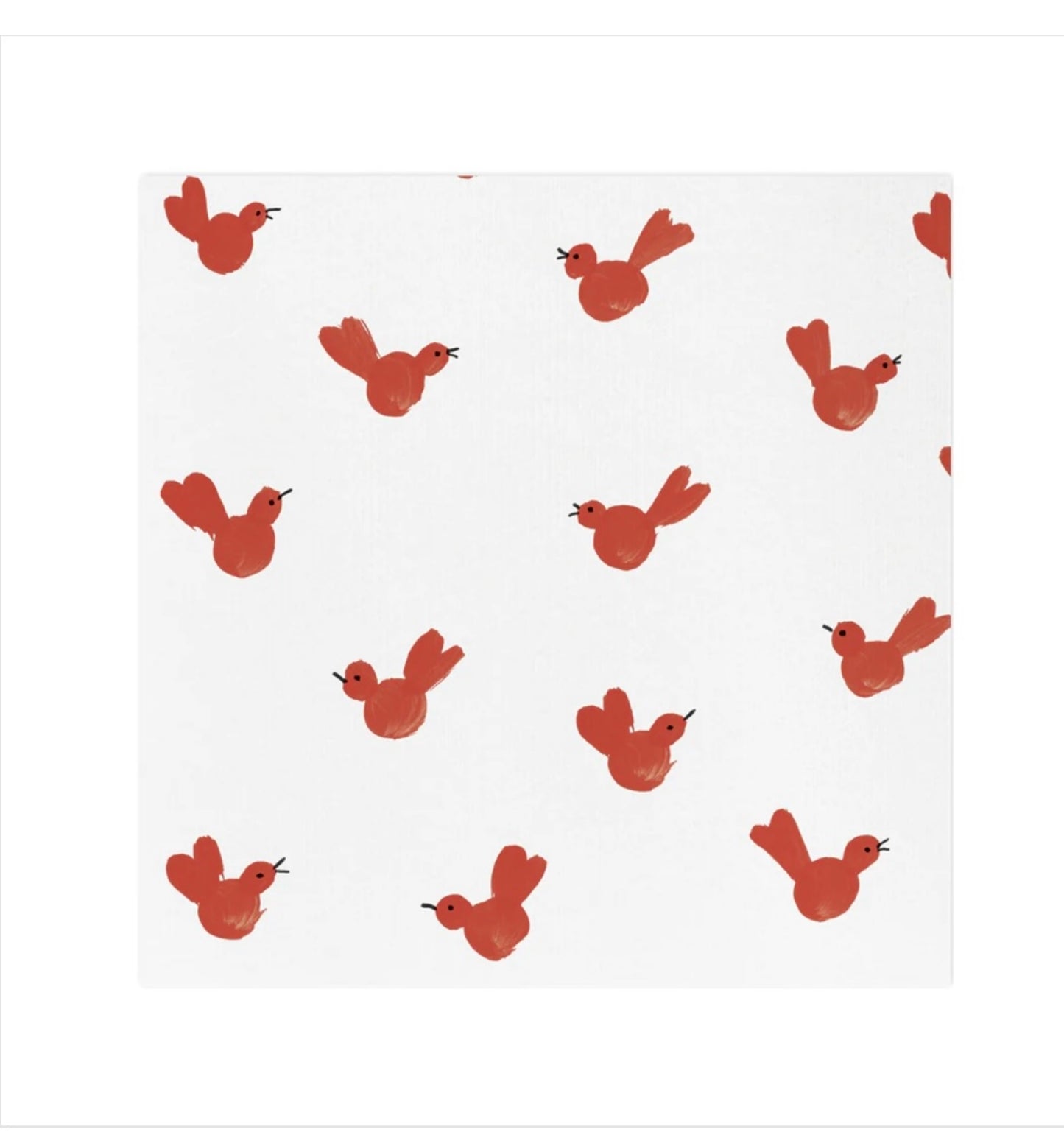 A flat lay of red bird patterned Papersoft cocktail napkins on a white background.
