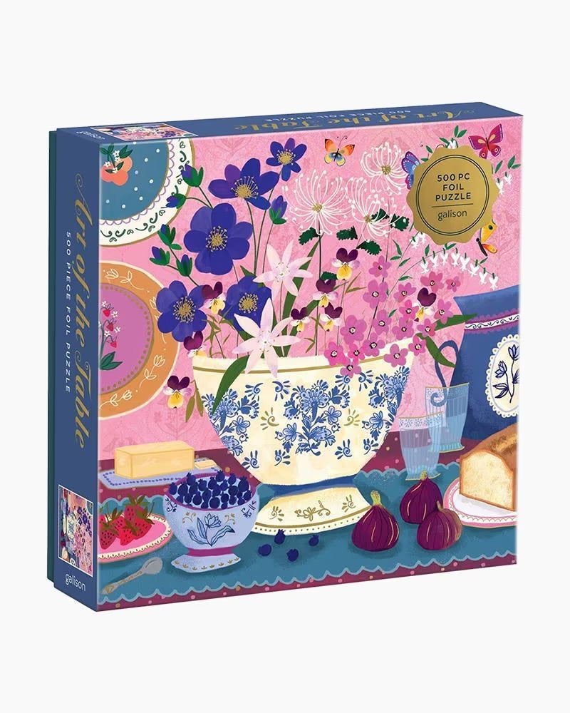Gibson puzzle box with floral and table setting design on a white background