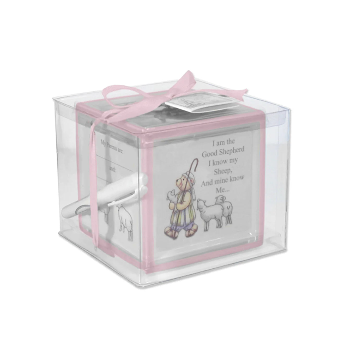 A ceramic block bank designed with pink colorful borders, intended for recording christening moments, shown with a ribbon and tag.
