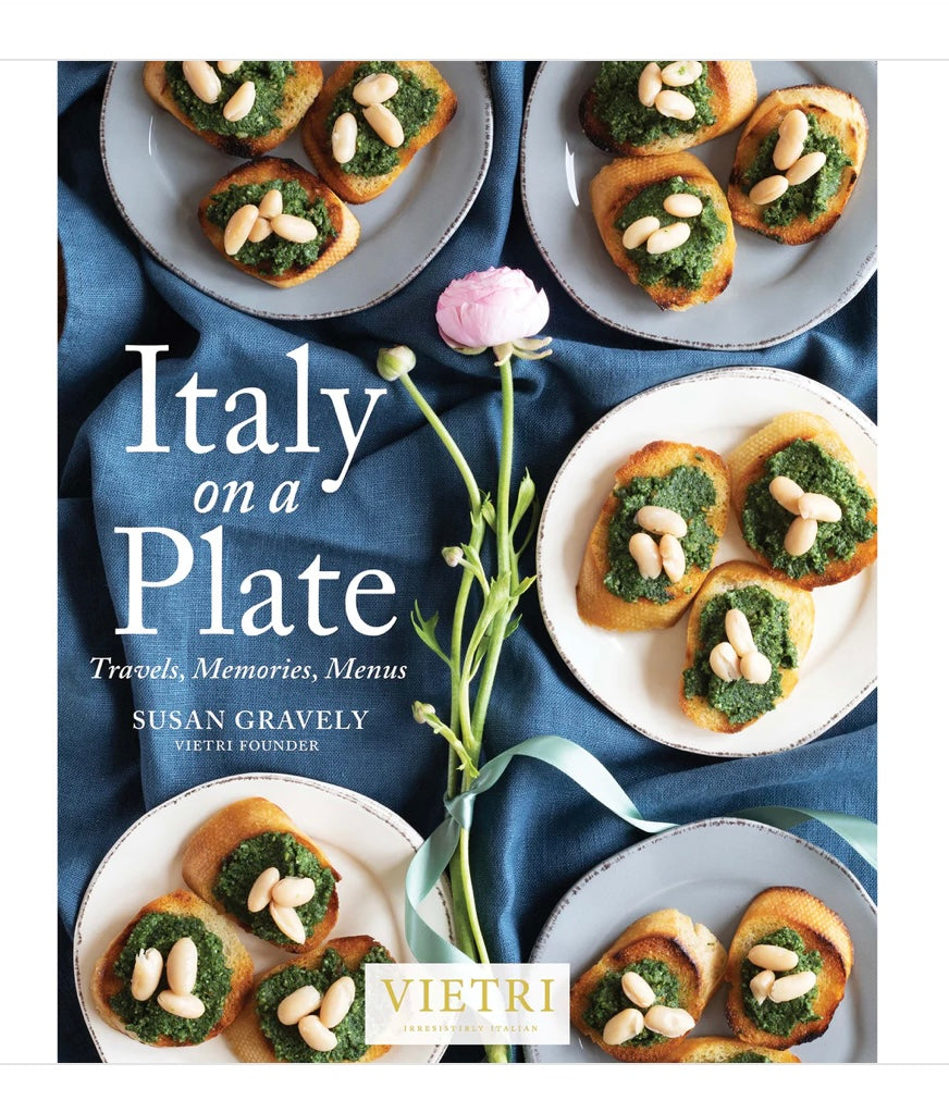 Cover of the book 'Italy on a Plate' by Susan Gravely, featuring a plate of food and a floral decoration.