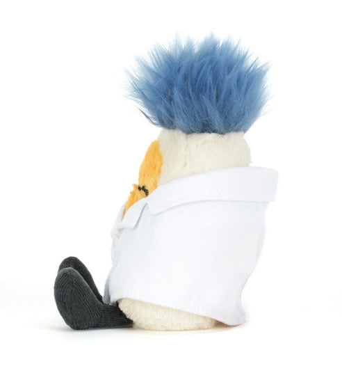 Plush toy resembling a character with blue hair and a white outfit on a white background
