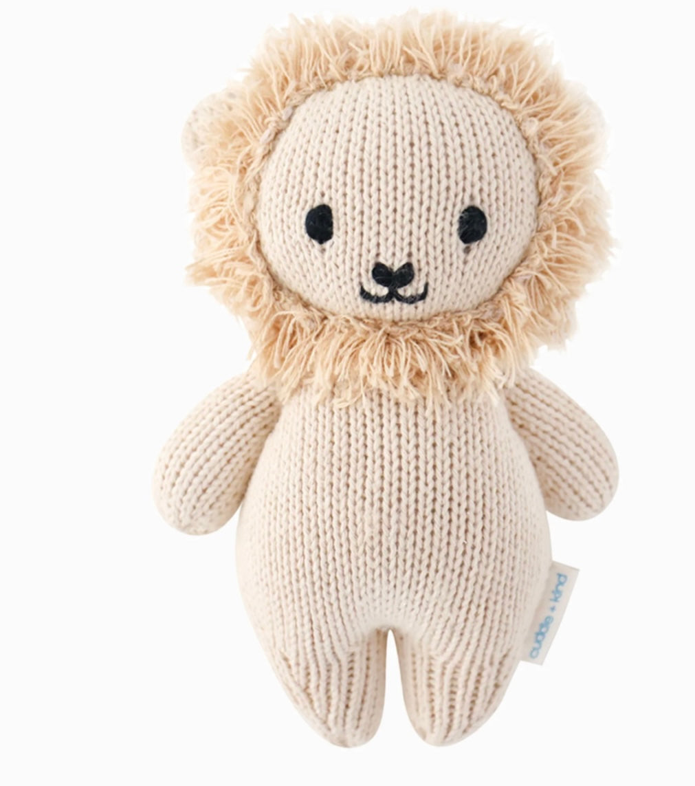 Hand knit beige lion toy with a fluffy mane