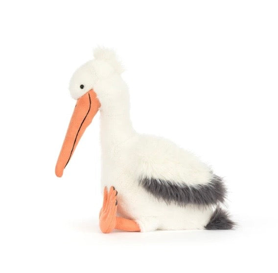 Stuffed pelican toy on a white background
