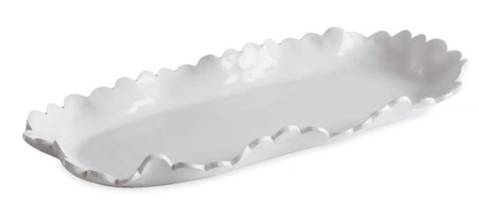White scalloped-edge tray on a white background