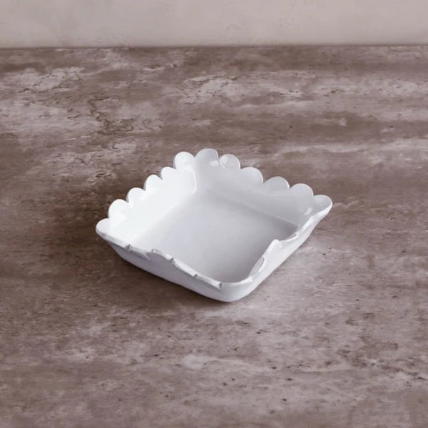White egg carton on a textured brown surface