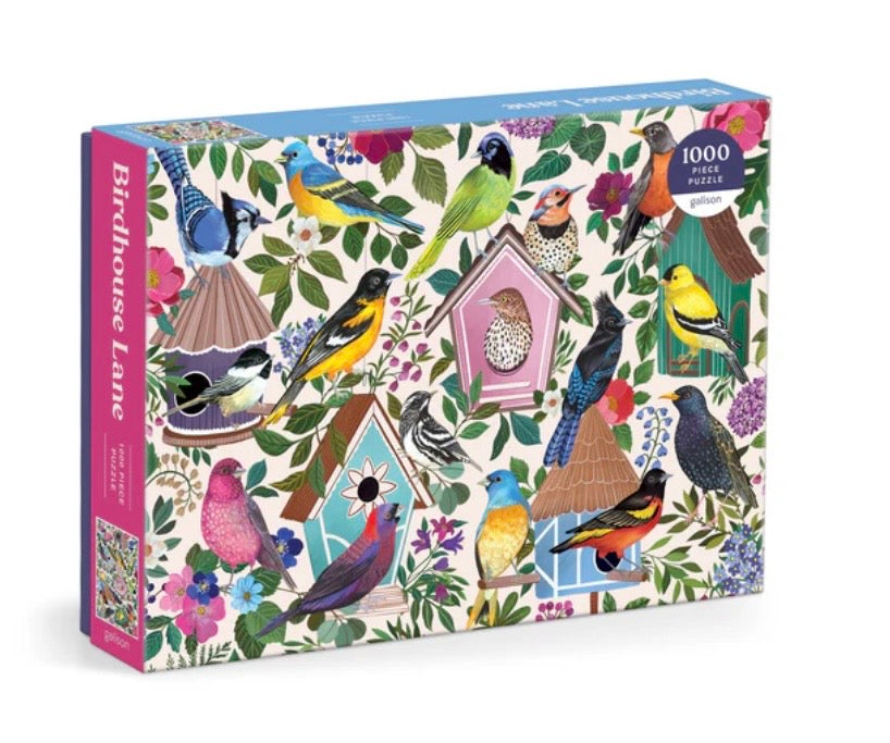 Jigsaw puzzle box with bird and birdhouse design on a white background