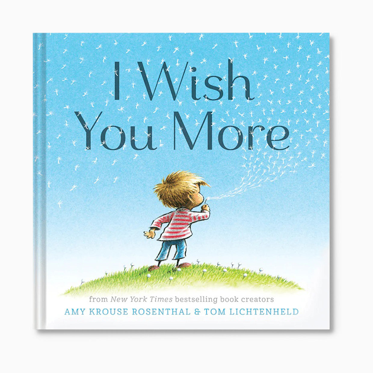 Book cover of 'I Wish You More' with a child blowing bubbles against a blue sky.