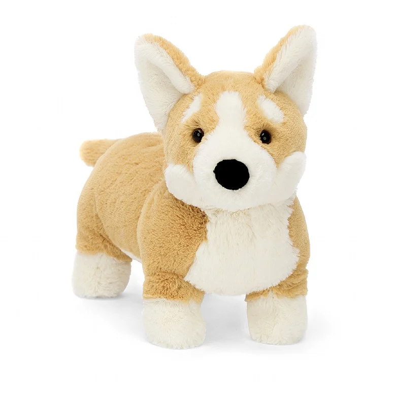 A beige and white stuffed toy resembling a corgi dog with a soft texture, featuring ginger fur, creamy splodges, a cloudy paw, and an inky nose.