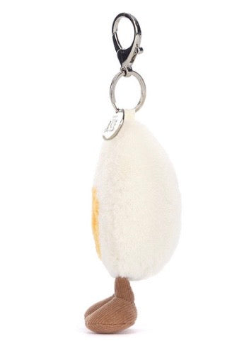 Keychain with a fluffy white ball and brown feet