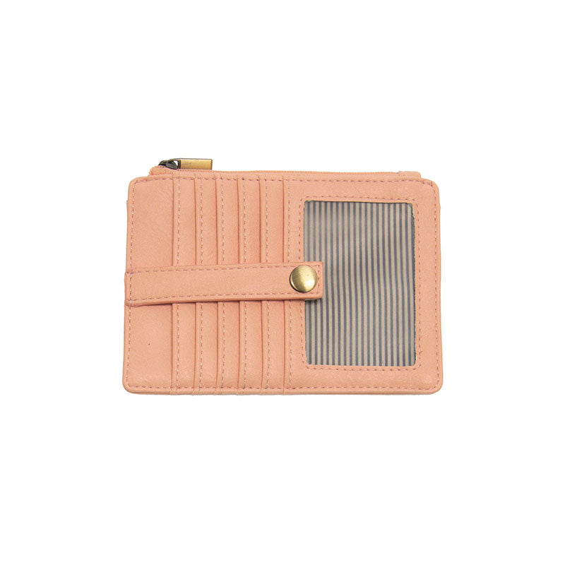 A crepe pink mini travel wallet with a top zip closure and multiple card slots, made from vegan leather.