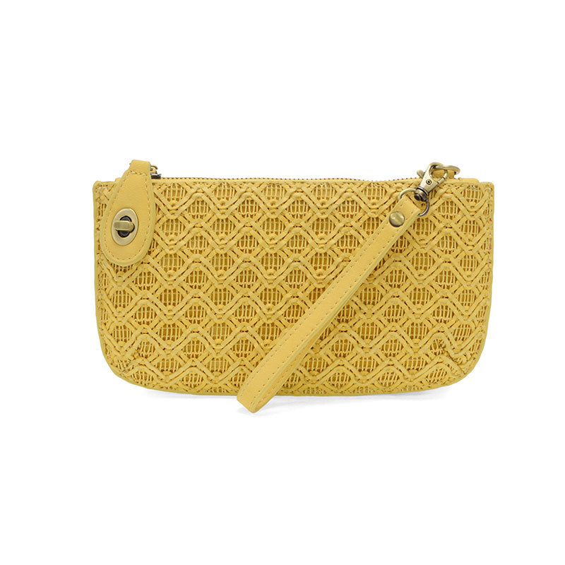 A yellow lattice woven mini crossbody wristlet clutch with a solid pattern and a turn lock closure.