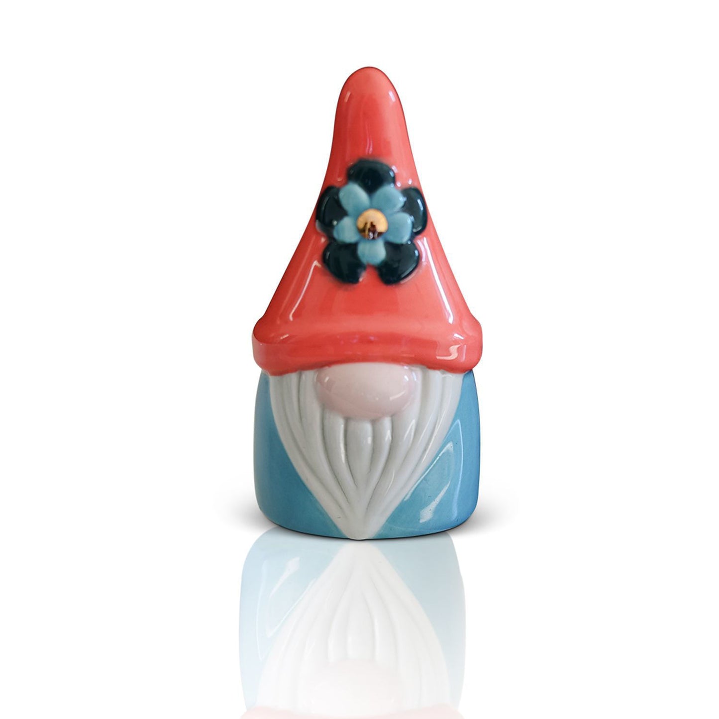 nora fleming mini gnome with a red hat, blue outfit, and a flower on the hat.