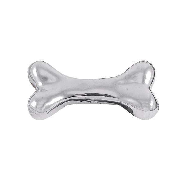 A silver-colored dog bone-shaped napkin weight made from recycled aluminum.
