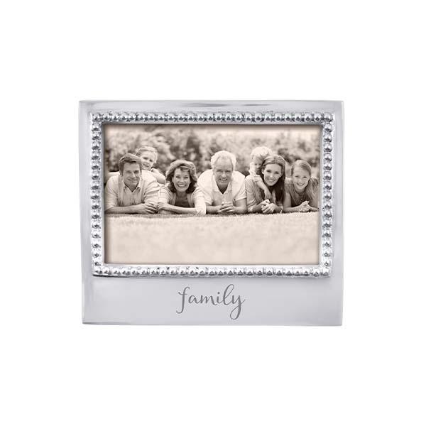 Silver family photo frame with a beaded edge and the word family engraved on the bottom.