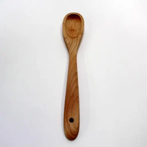 Maple shallow spoon on a white background
