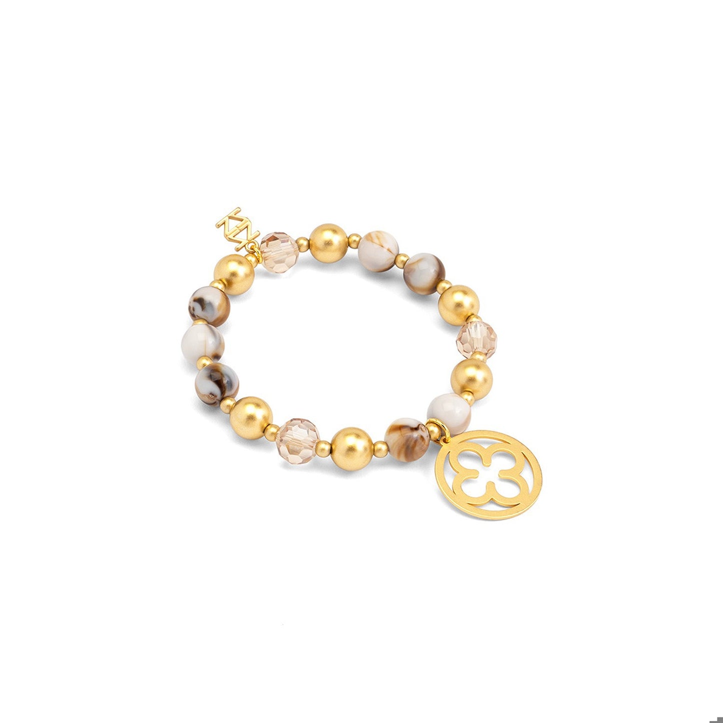 A beaded stretch bracelet featuring gold-plated beads, marbled white and brown beads, clear faceted beads, and a gold-toned circular clover charm.