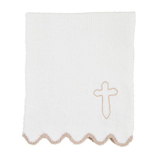 A white chenille blanket with scallop trim and a hand-stitched embroidered cross in the corner.