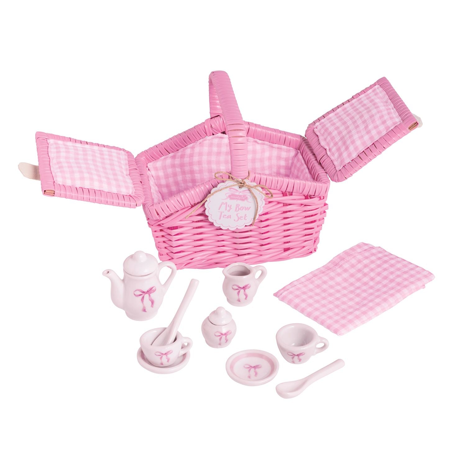 Pink wicker picnic basket with matching tea set with bows on a white background