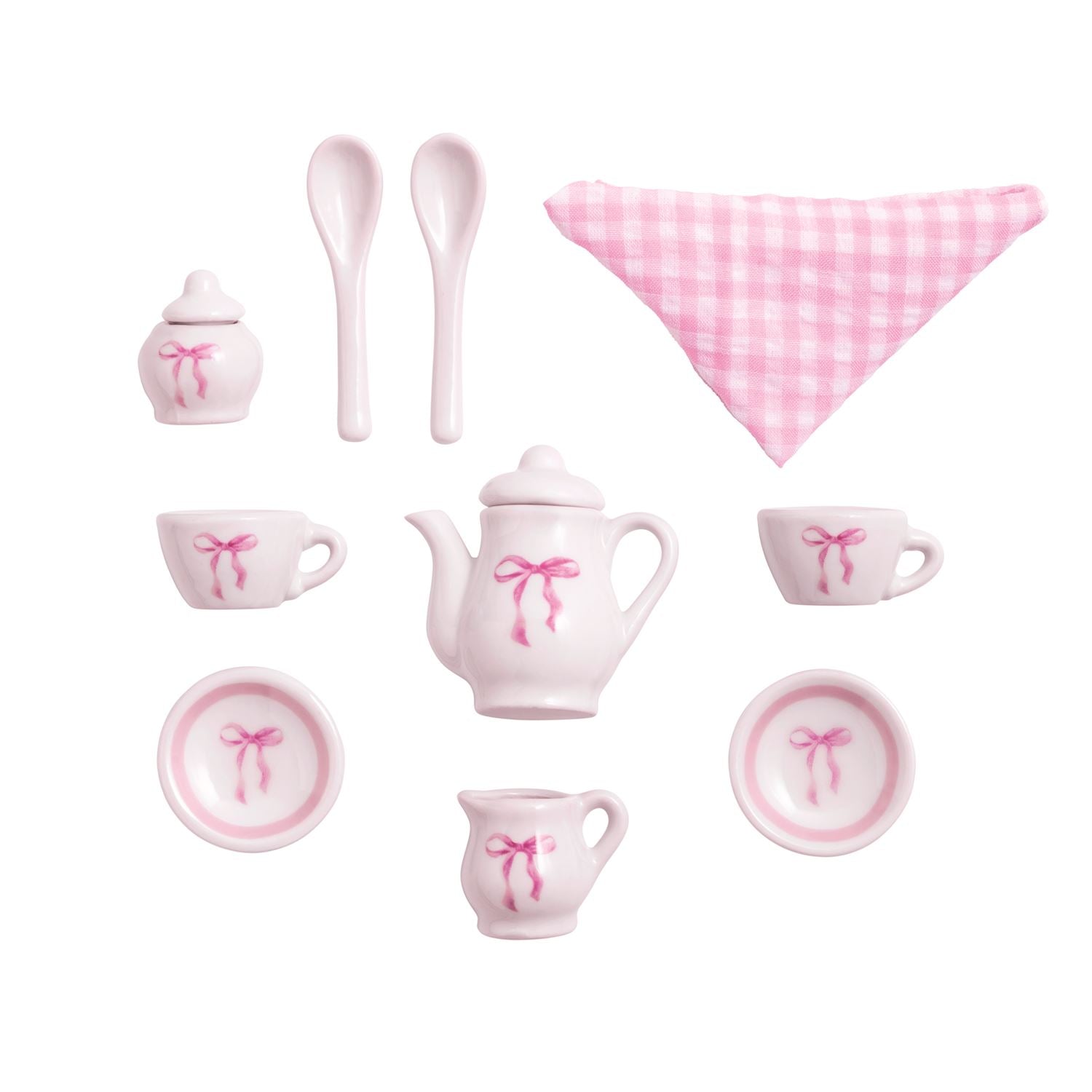 Pink ceramic tea set with bow details on a white background