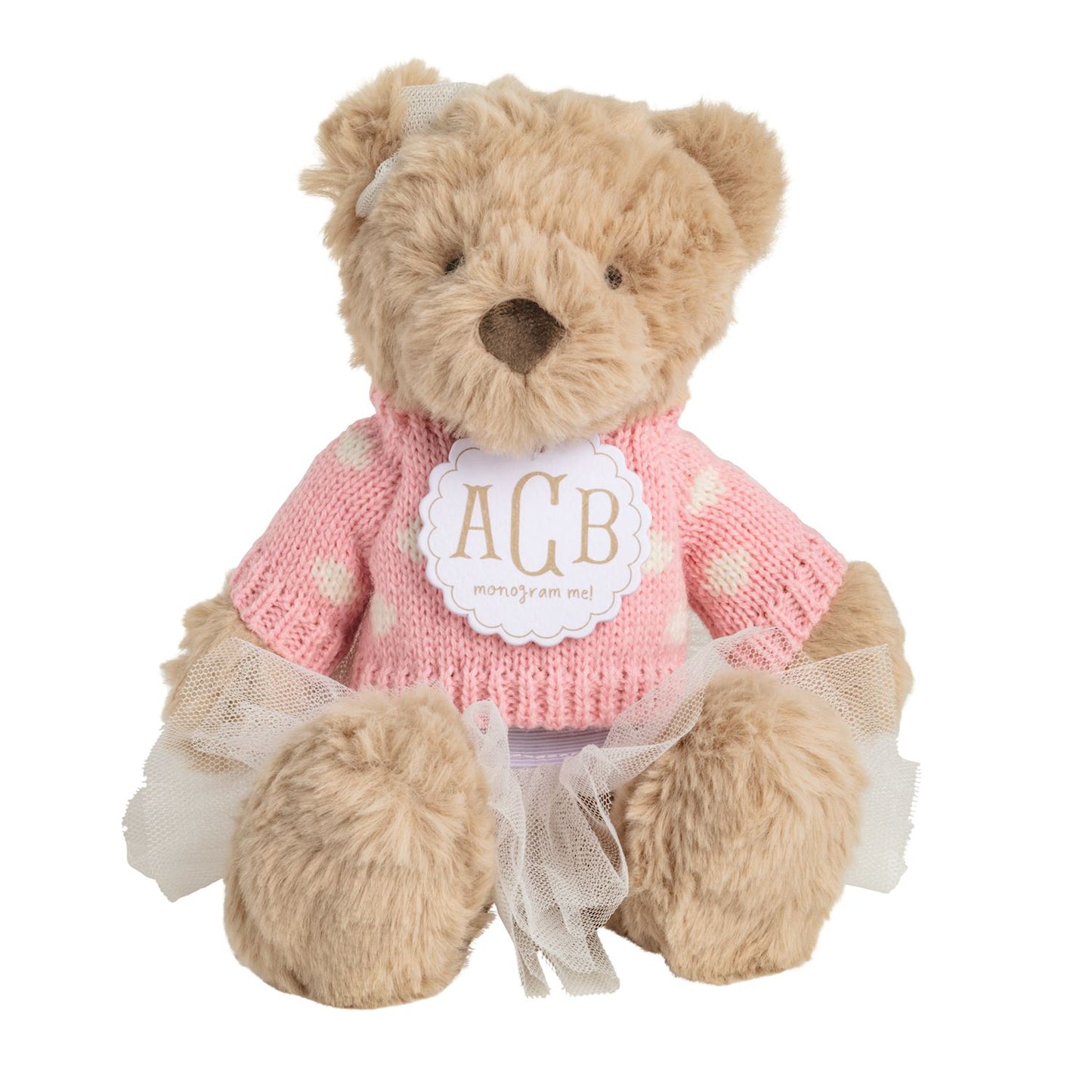 ACB monogram Teddy bear wearing a pink sweater with a label on a white background