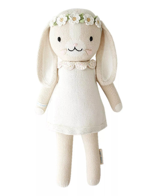 Hand knit bunny toy with a white dress and flower headband 