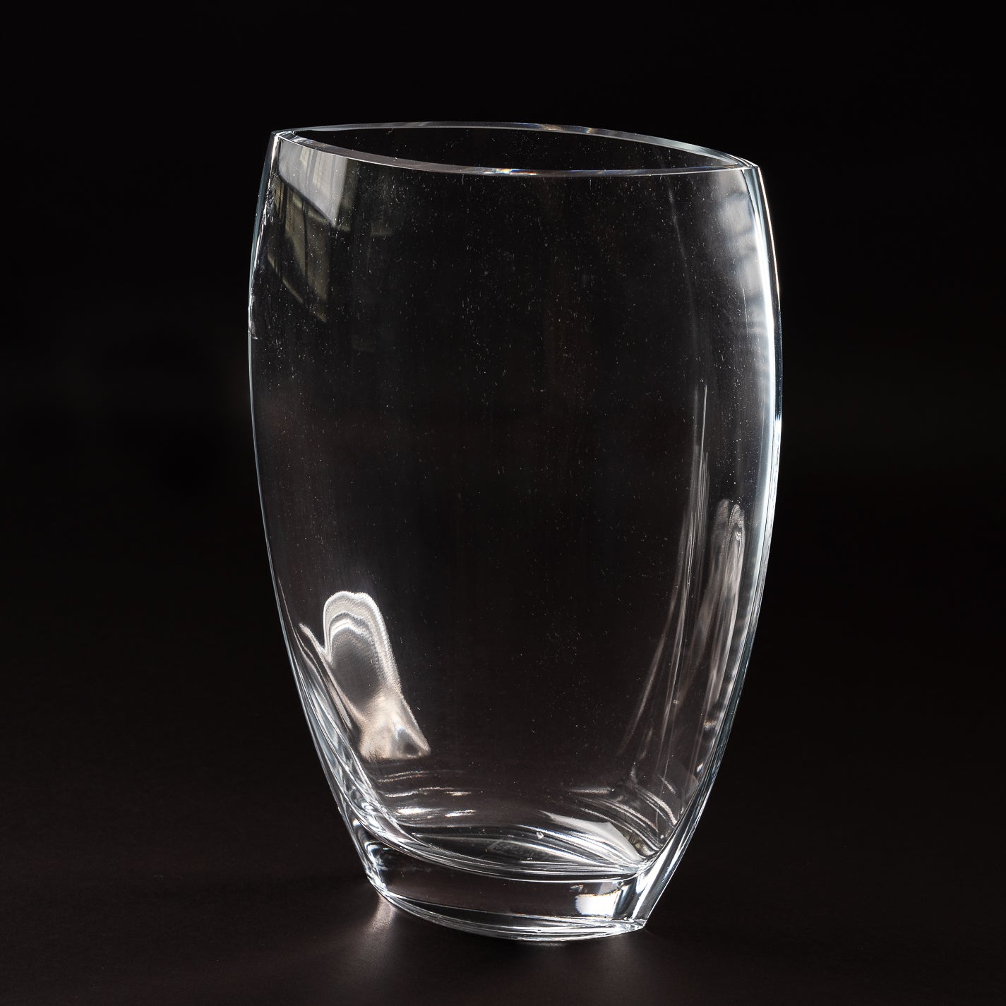 An oval, lead-free crystal vase with a sleek design.