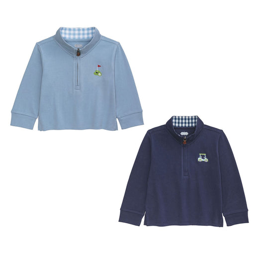 Two children's long-sleeve quarter zip shirts by mudpie , one light blue with a golf hole emblem and one navy blue with a golf cart emblem, on a white background.
