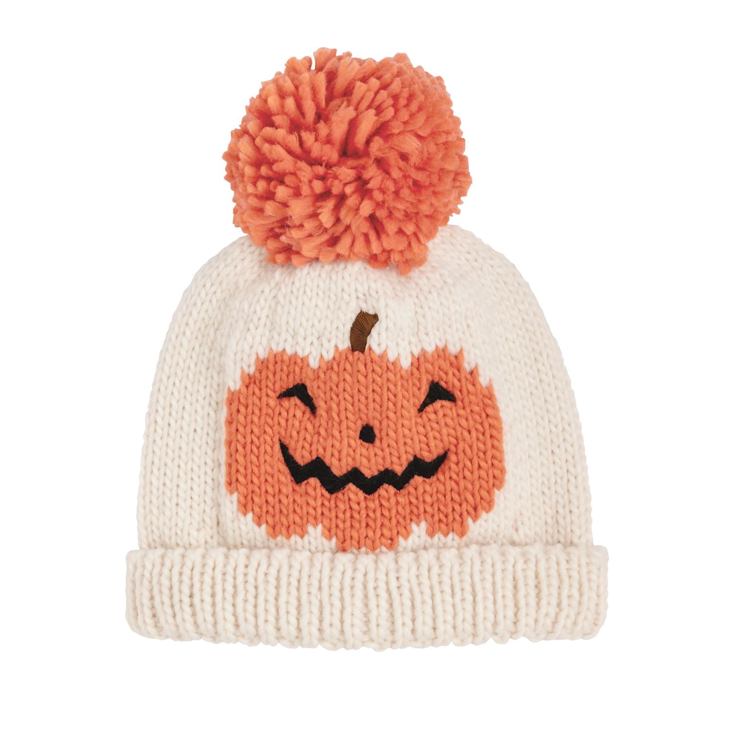 An off-white knit beanie hat featuring a knitted orange jack-o'-lantern face on the front and a matching orange pom-pom on top