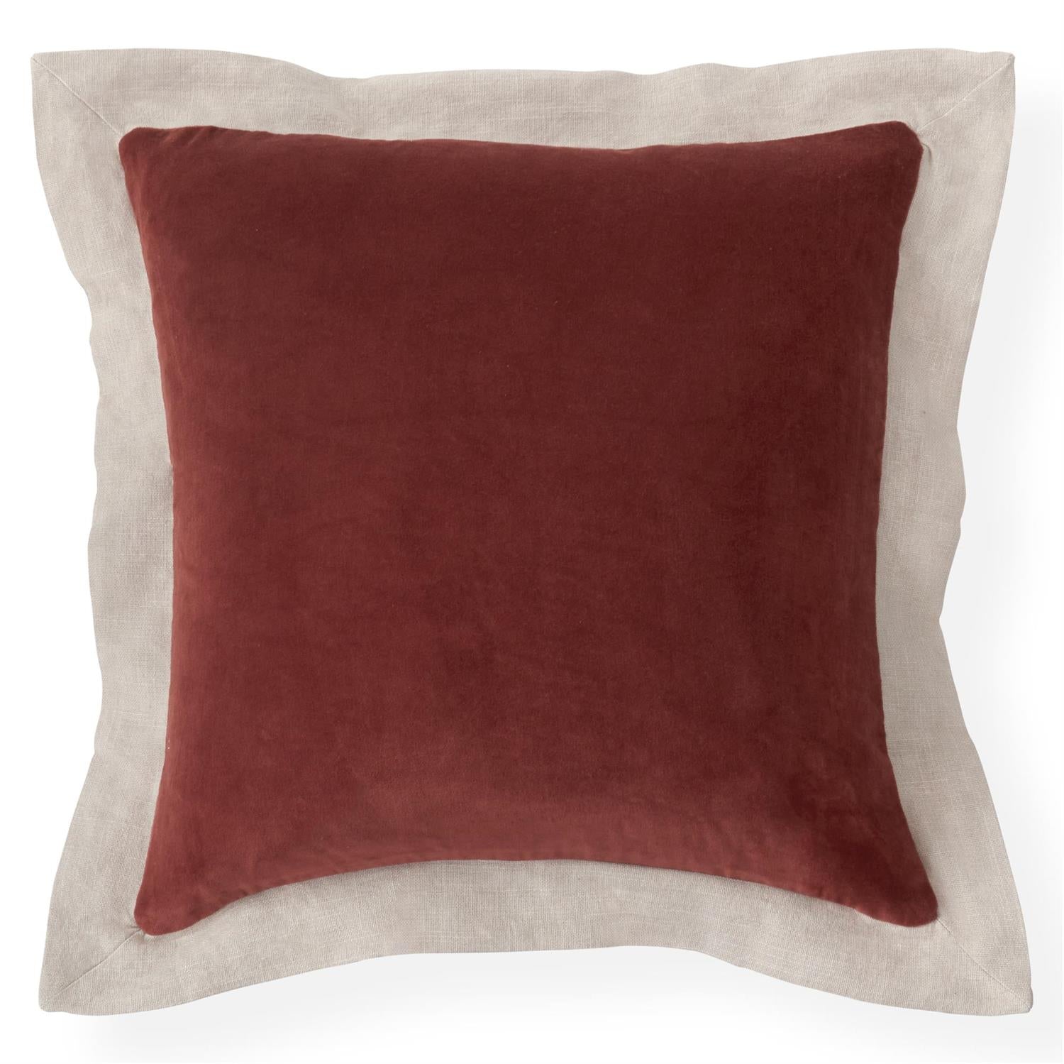 Rust colored velvet square pillow with a tan burlap flange