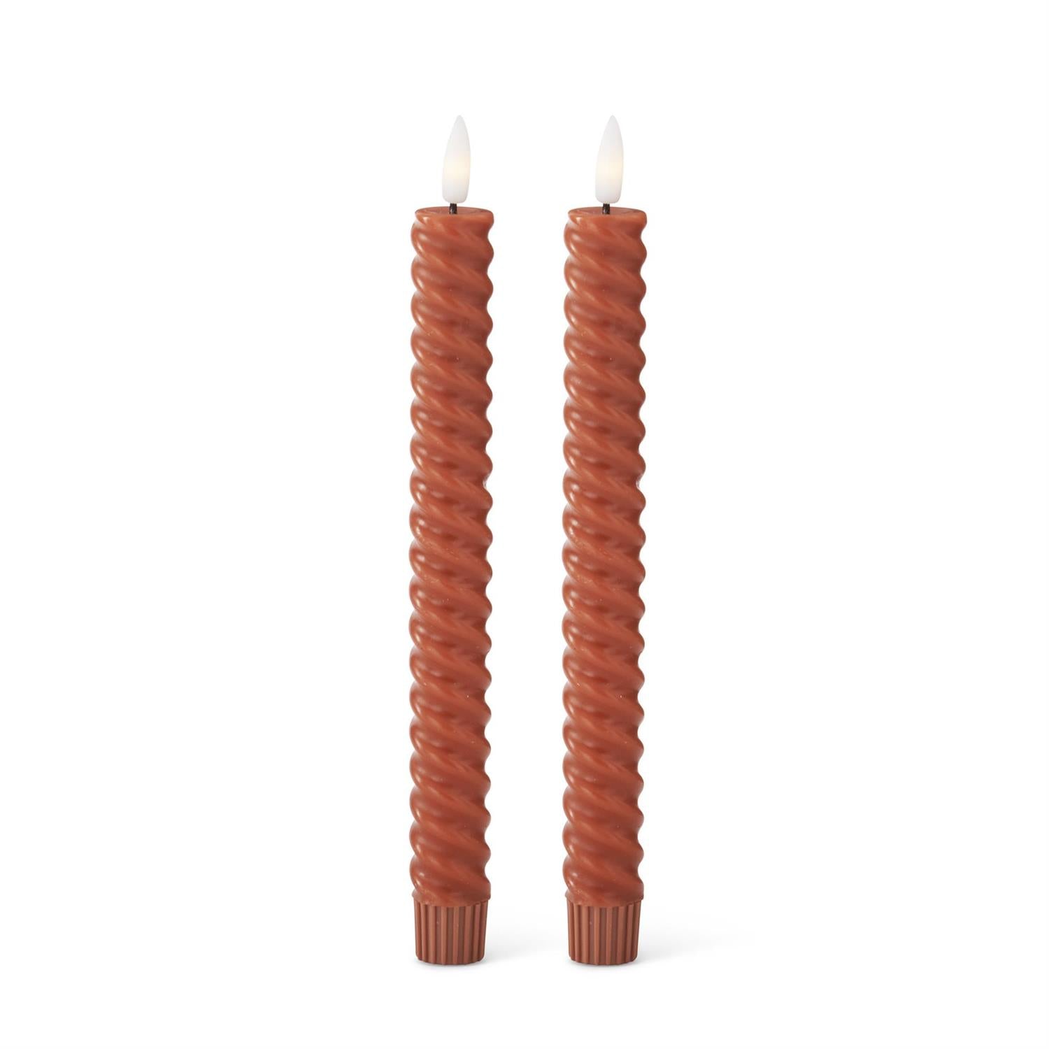 Two twisted LED taper rust-colored candles