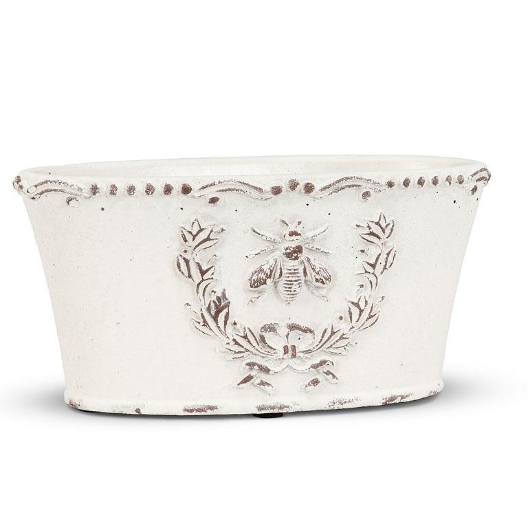 Decorative white oval planter with bee crest design 