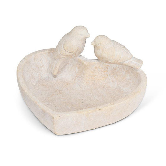 heart shaped cement dish with 2 birds perched on the edge