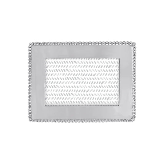 A silver metal 4x6 picture frame with a beaded border design.