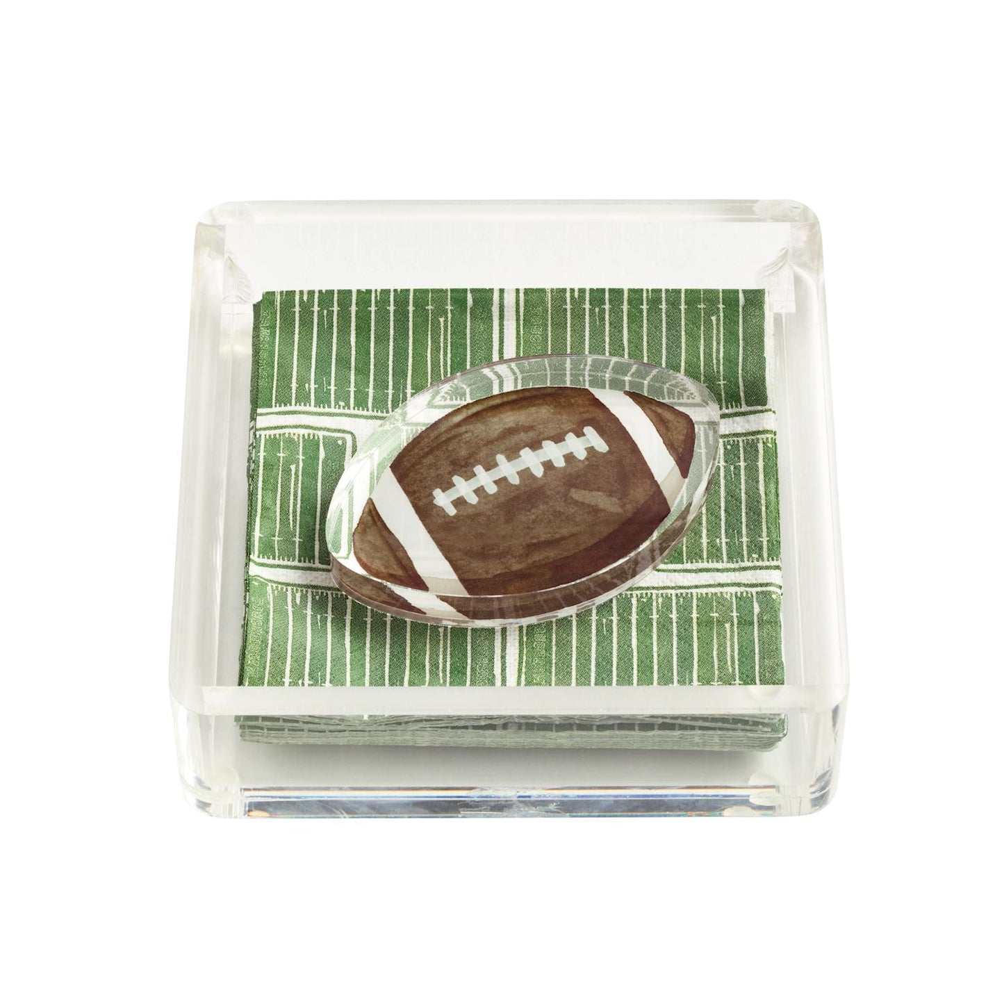 clear acrylic napkin holder with napkins that look like a football field and a napkin weight in the shape of a brown football