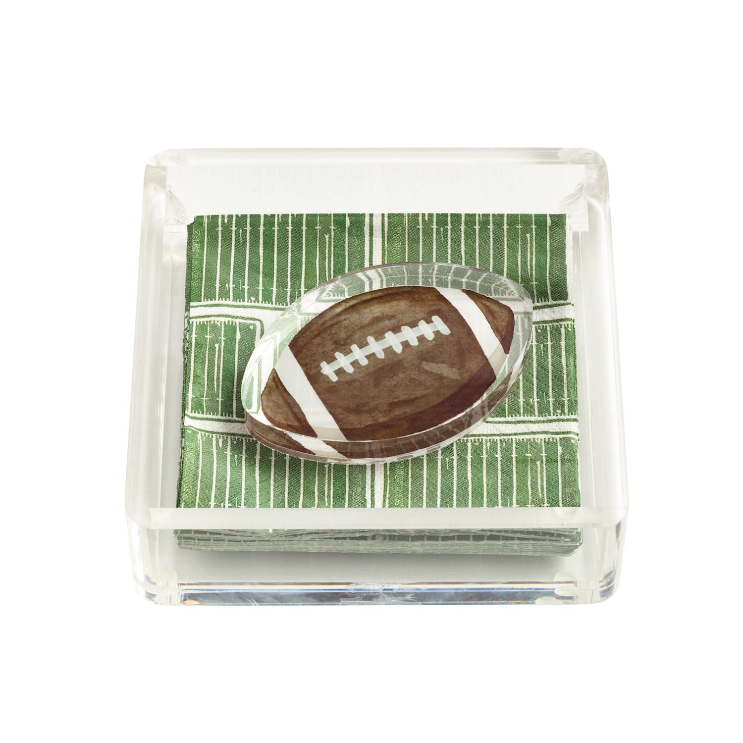 clear acrylic napkin holder with napkins that look like a football field and a napkin weight in the shape of a brown football