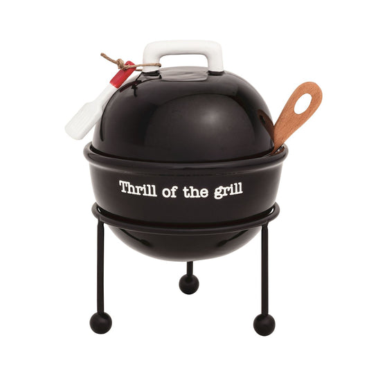 Black tidbit grill with 'Thrill of the grill' text. the set includes a wooden spoon and spatula