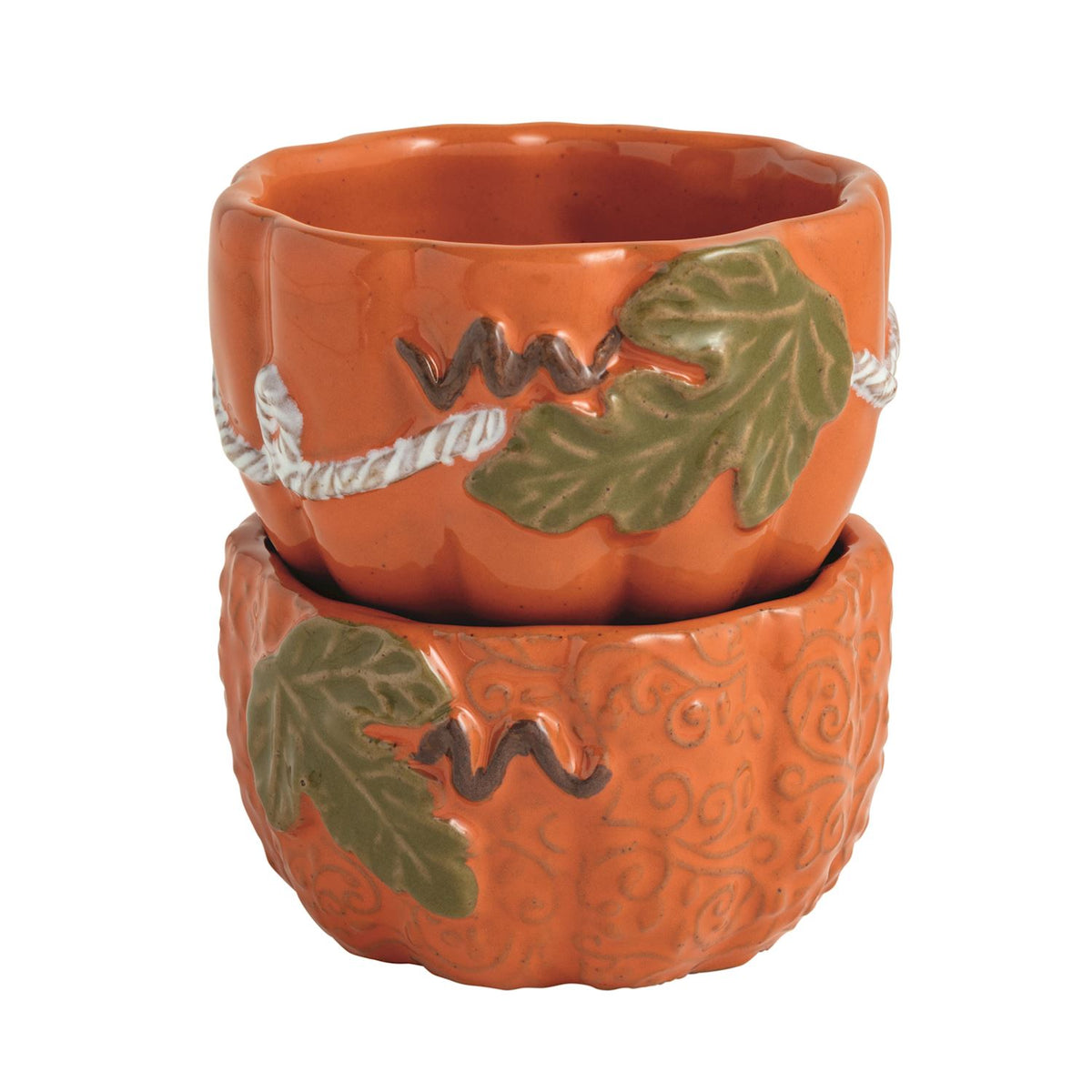 Two stacked ceramic pumpkin-shaped bowls in terracotta orange with green leaf and white rope details, shown on a plain white background.