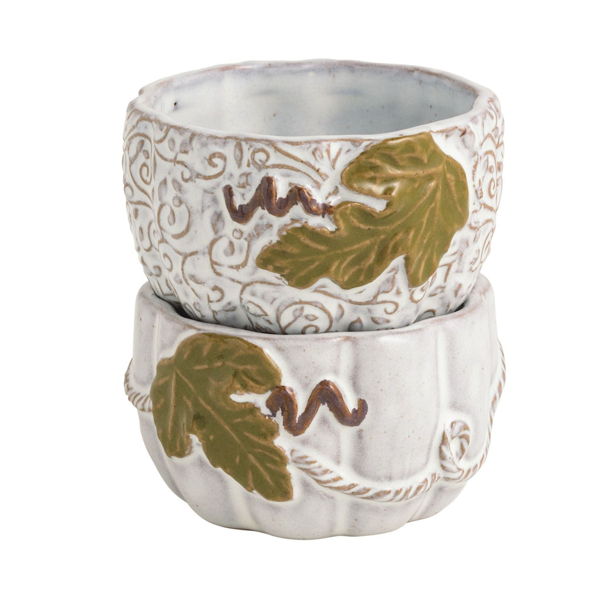 Two stacked small ceramic cups with a white embossed scroll pattern, olive green leaf motifs, and brown wavy accents, shown on a plain white background.