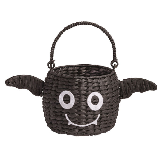 Woven trick-or-treat basket with a bat face and wings on a white background