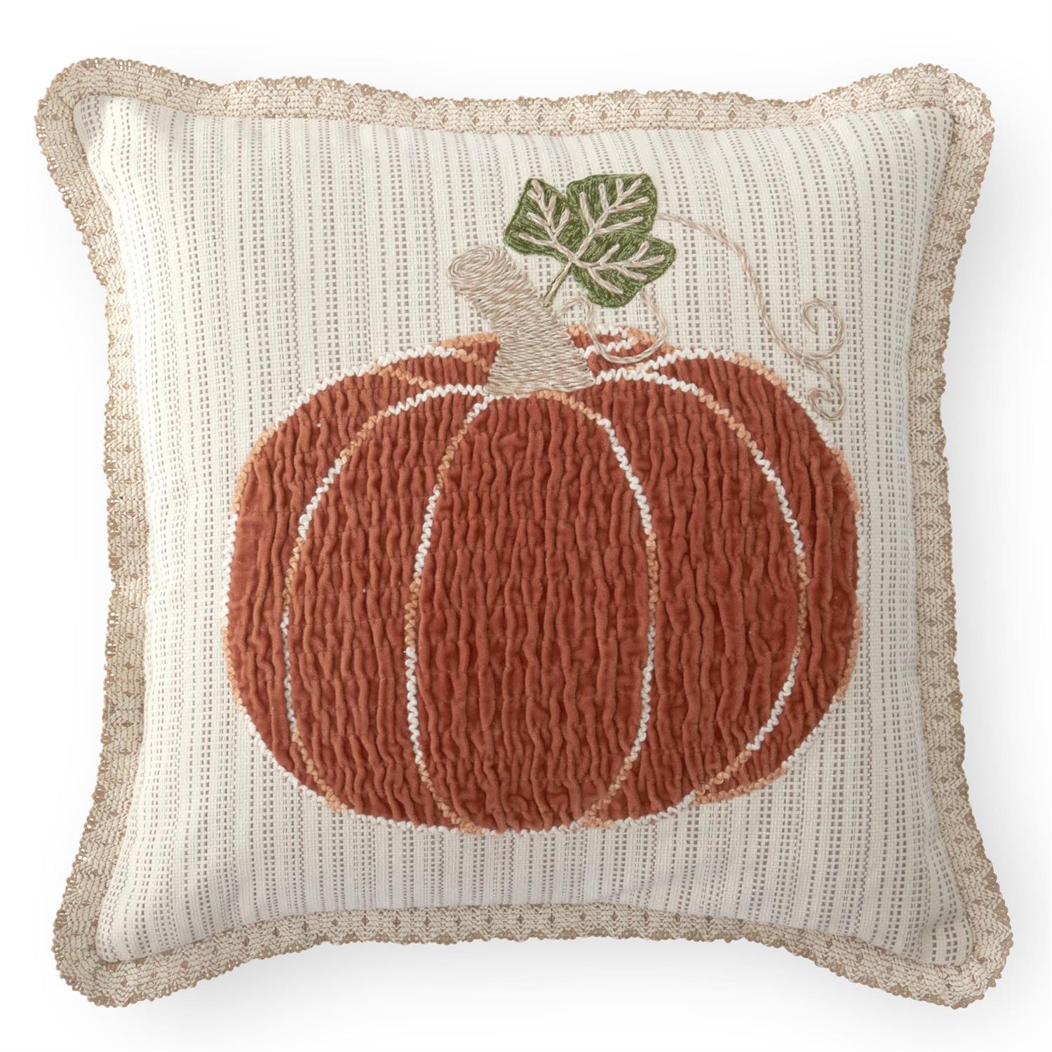 Decorative square pillow with a textured pumpkin design a cream background