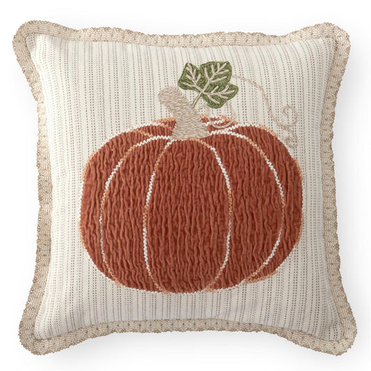 Decorative square pillow with a textured pumpkin design a cream background