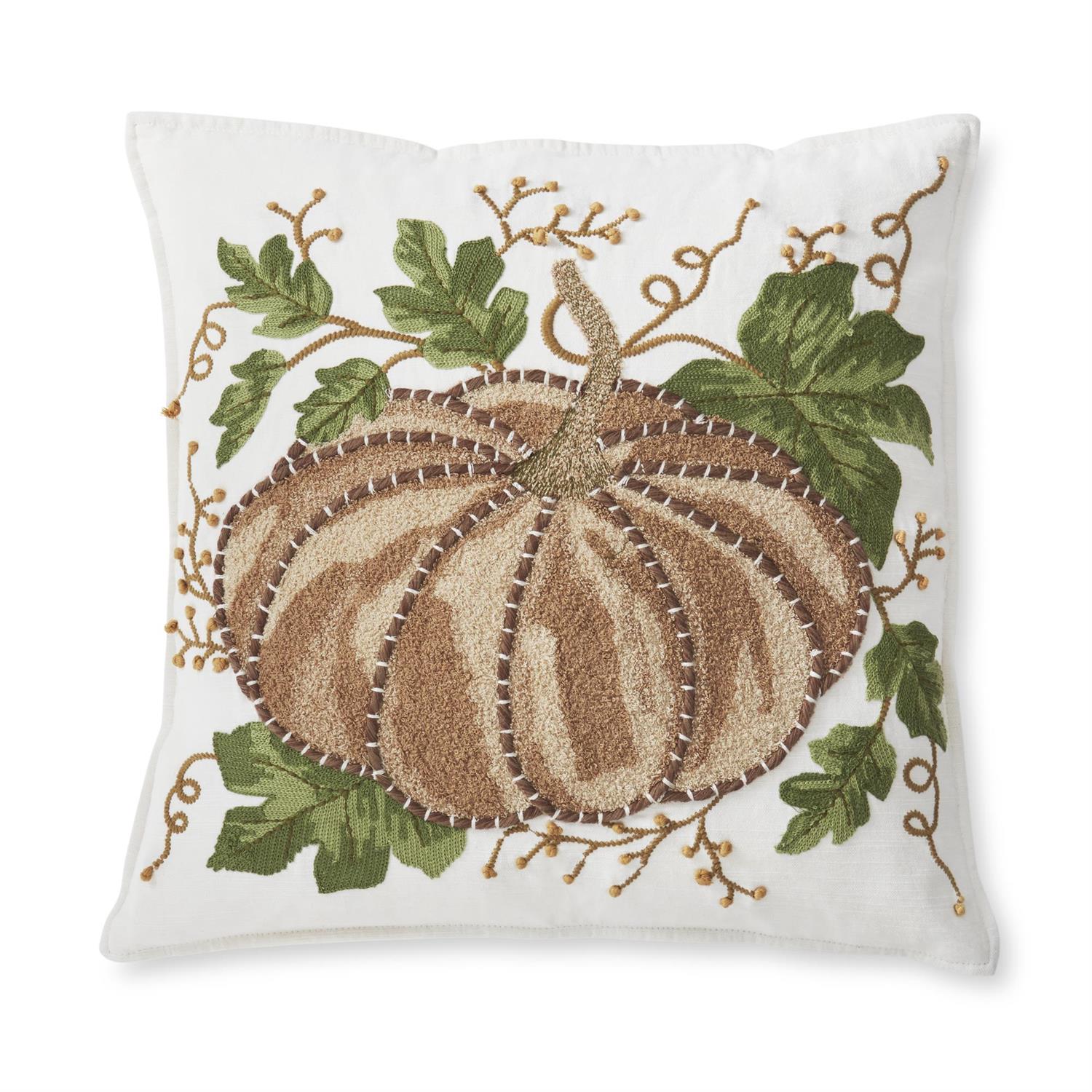 Decorative square pillow with embroidered brown pumpkin and leaves on a white background