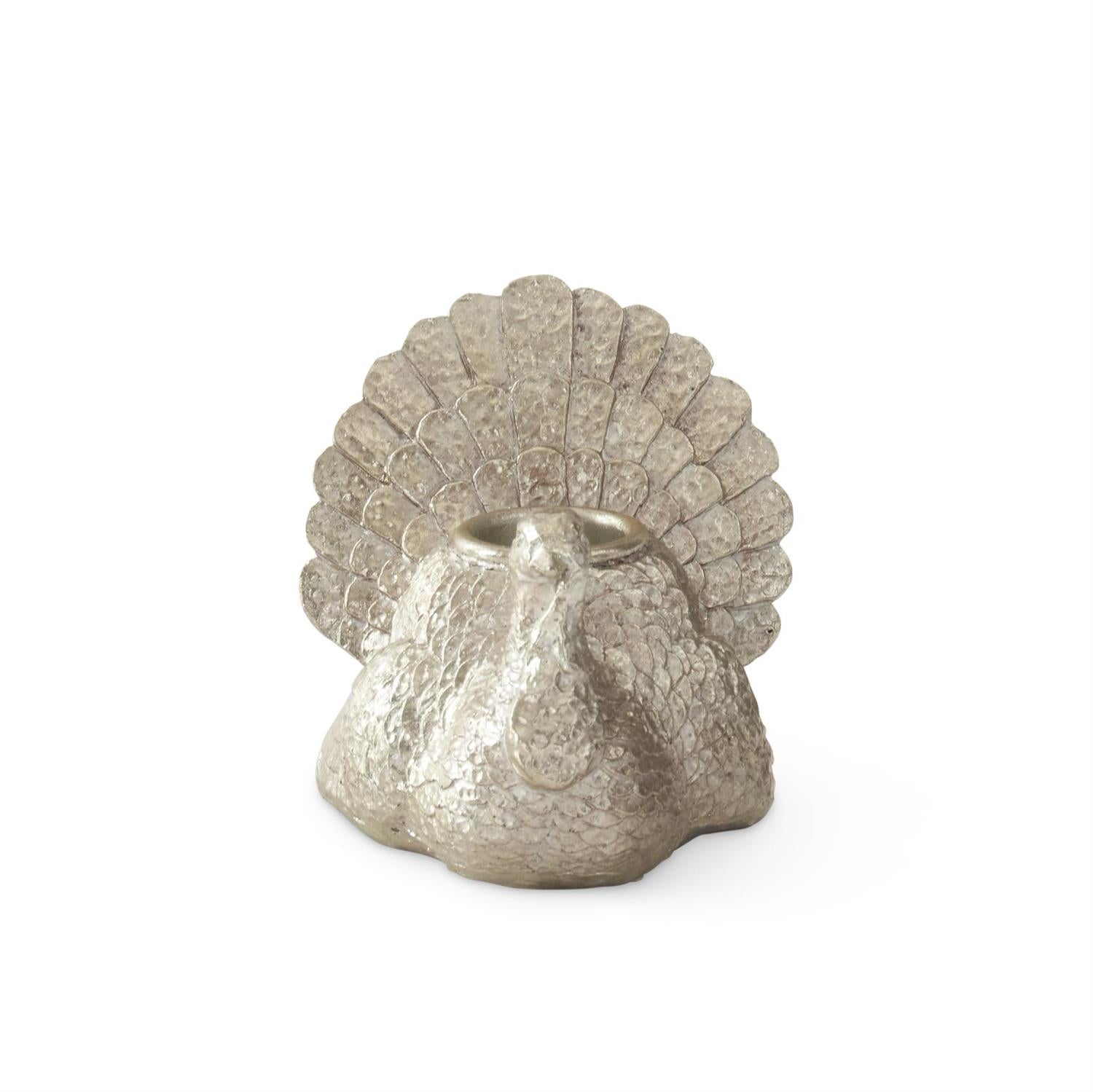Decorative silver turkey-shaped candle holder on a white background