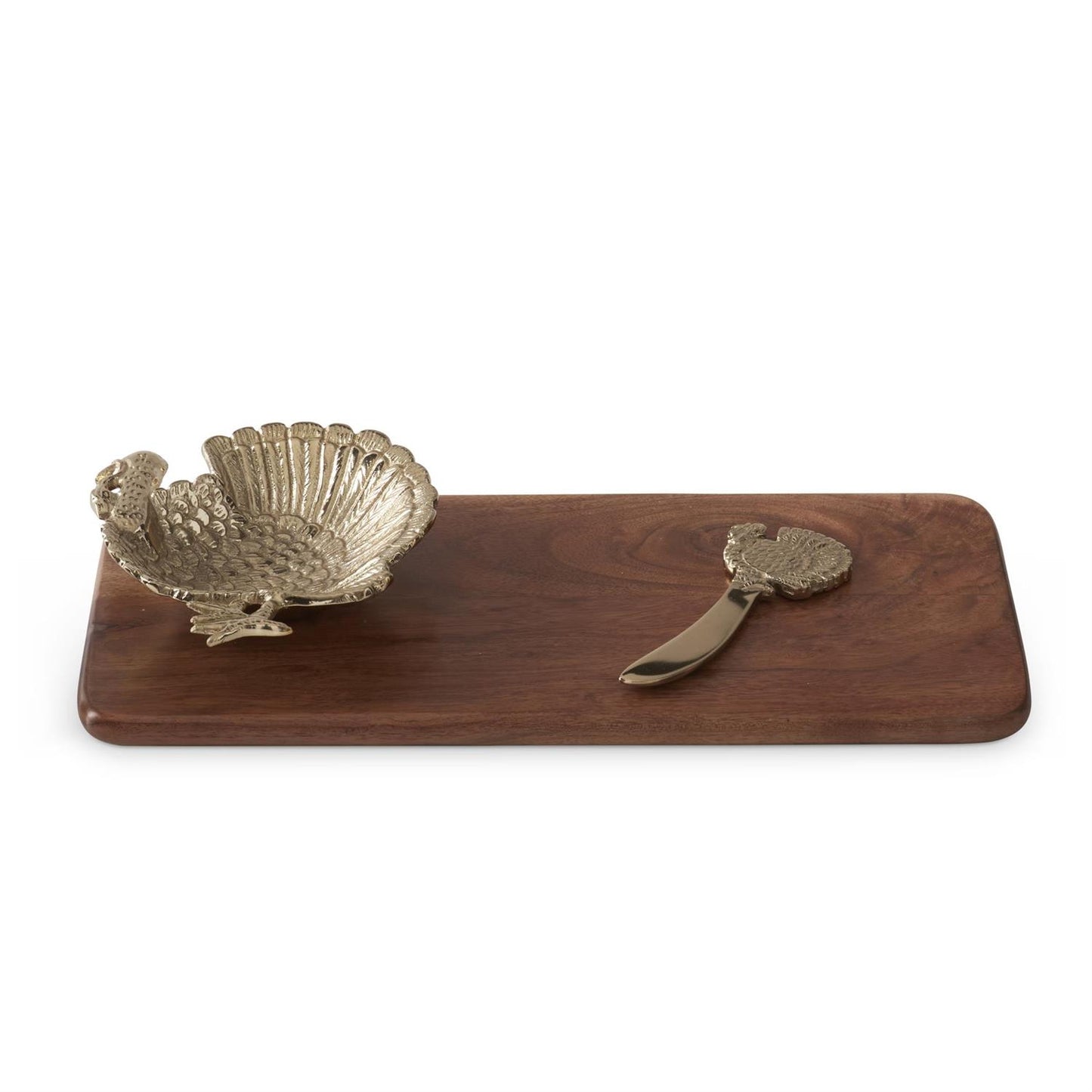 Wooden cheese board with a turkey-shaped bowl and spreader on a white background